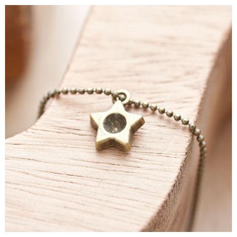 Breloque Petite étoile trou Bronze vieilli