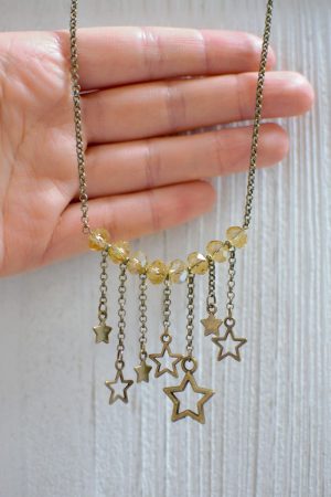 zoom collier étoiles bronze vieilli et jaune